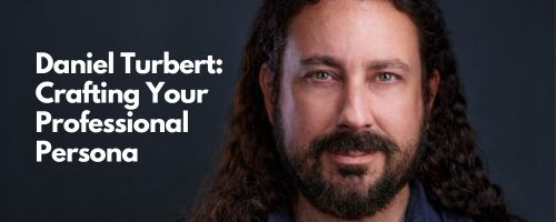 A man with long curly hair and a beard smiles slightly at the camera. White text beside him reads: Daniel Turbert: Crafting Your Professional Persona. This showcases expert personal branding photography against a dark background.